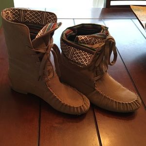 Brown suede moccasin boots with tribal lining