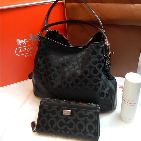 Timeless black Coach purse with purple lining.