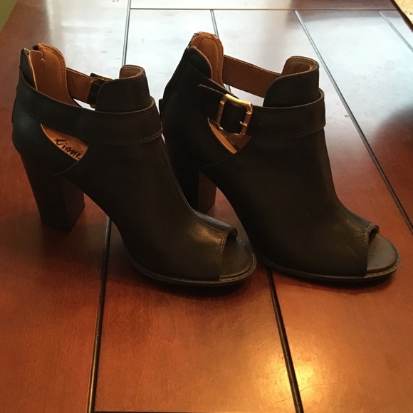 Black peep toe bootie with gold buckle