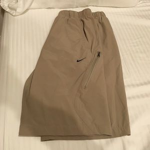 Khaki colored Nike athletic shorts