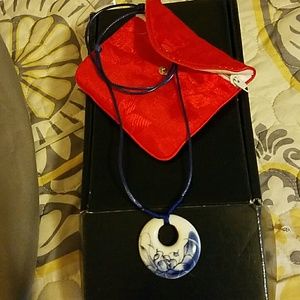 GIFTED-GLASS HAND PAINTED  PENDANT ON NAVY CORD