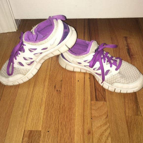 Purple and White Nike sneakers