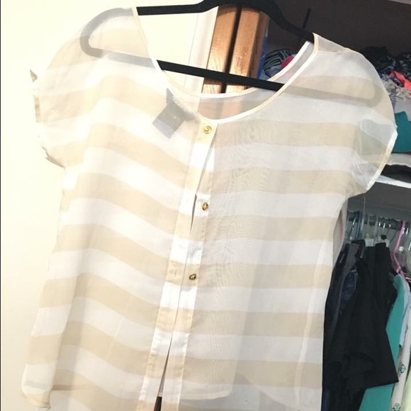 Sheer type material. Buttons down back.