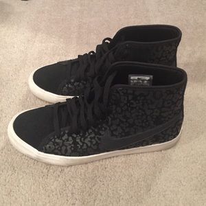 Black cheetah print Nike sneakers
