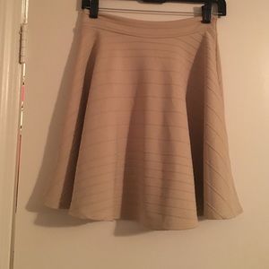 Khaki colored skater skirt.