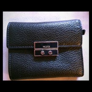 TUMI Brand New black leather wallet!
