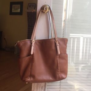 Medium sized zipper top Michael Kors purse