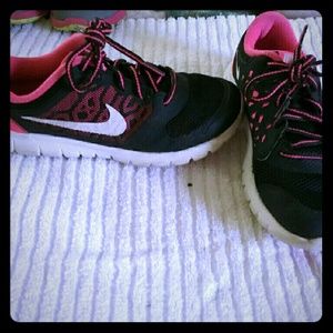 Nike Kids black and pink tennis shoes