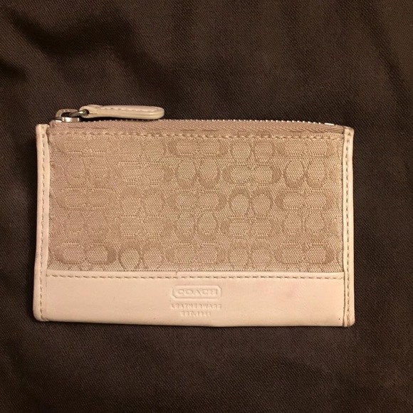 Cream colored Signature Coach change purse