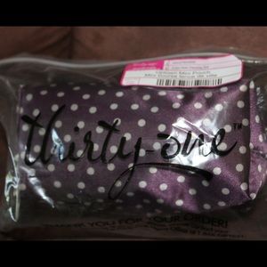 Uptown mini pouch in plum dancing dot