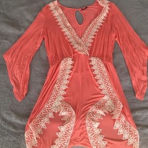 Large coral and white romper
