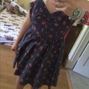 Super cute navy dress with polka dots and roses!
