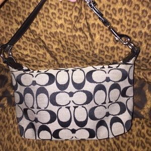 Black coach bag with "C"