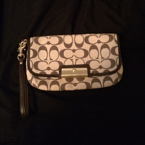 Large signature coach wristlet.