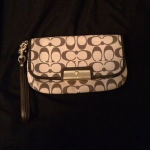 Large signature coach wristlet.