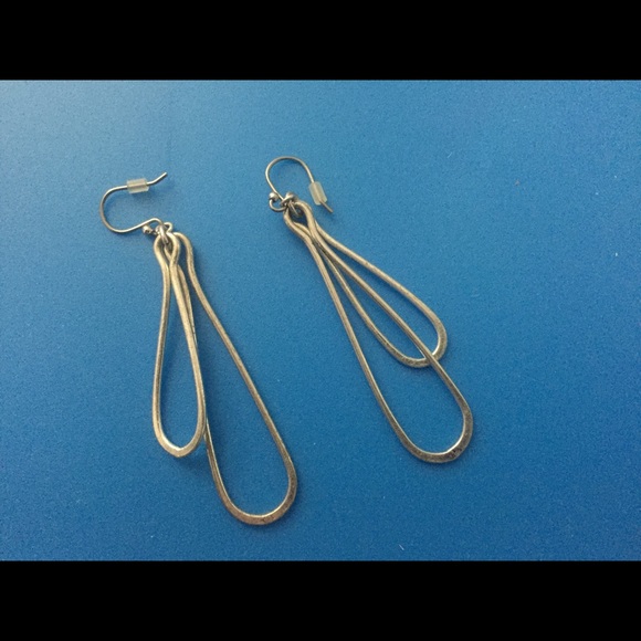 Silver dangle earrings.