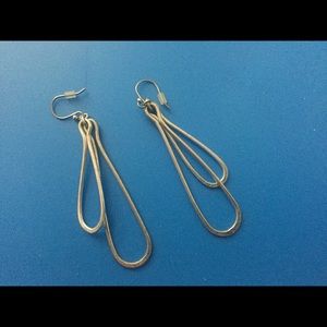 Silver dangle earrings.