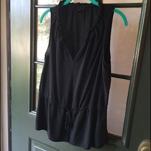 Black sleeveless V neck top, ties at waist