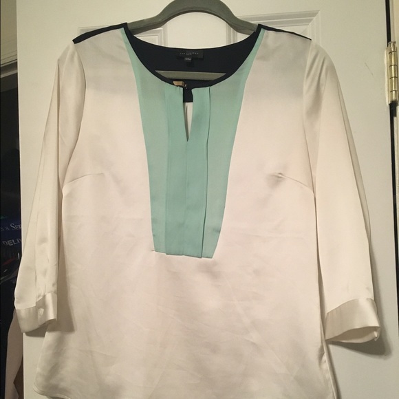 Silky blouse with blue detail.