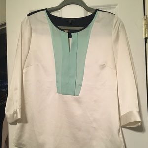 Silky blouse with blue detail.