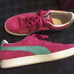Pink and white Pumas suede