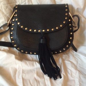 Black studded black cross body bag with tassel