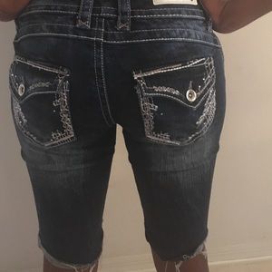 Knee-length jean shorts.