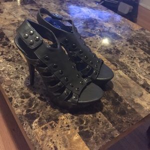 Nice dark green heels with a strap in the back.