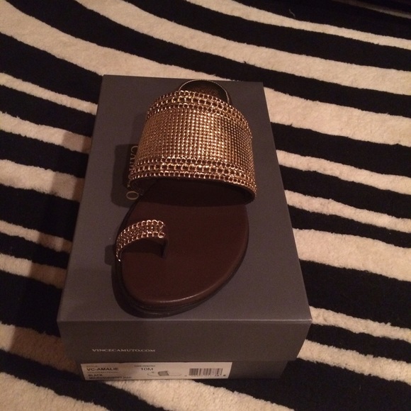 Vince Camuto gold sandals.