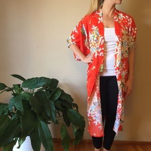 Women's orange and flowered kimono robe