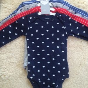 Carter's 4 pack of long sleeved bodysuits for baby