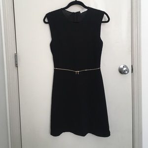 Sandro LBD with gold zipper at waist.