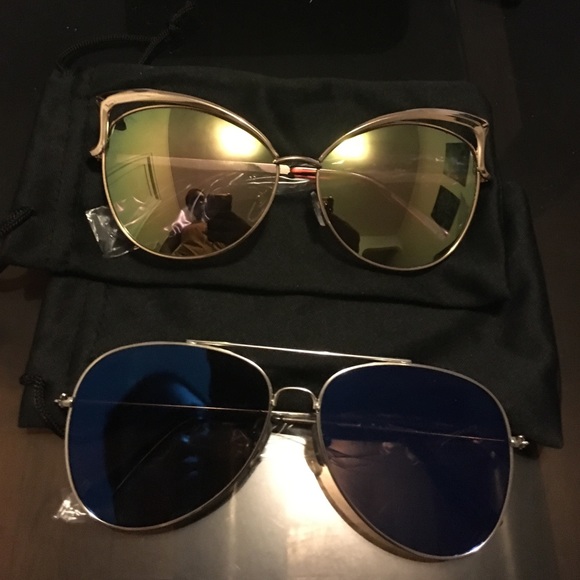 2 pairs of sunglasses and their cloth bags