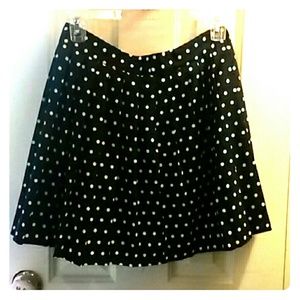 Navy polka dot pleated skirt