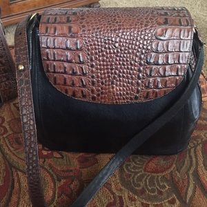 Brahmin black leather purse with brown trim