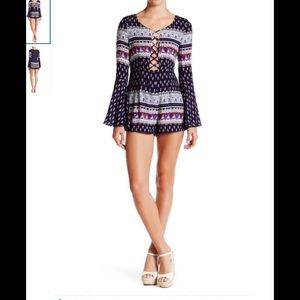 Sold Out.NWT. Bell sleeves printed romper.