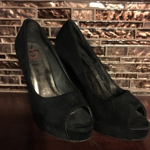 Black suede heels, gently worn.