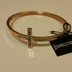 Rose gold colored cross bangle