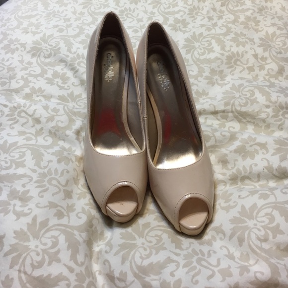 Pale pink peep toe pumps