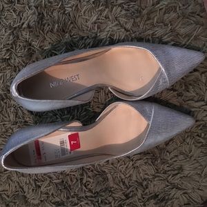 Pumps.  Very cute!  Hard to find silver.