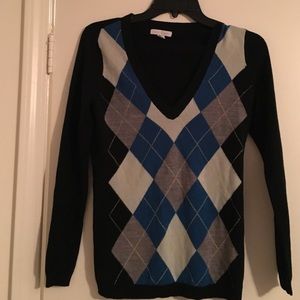 Black and grey sweater.