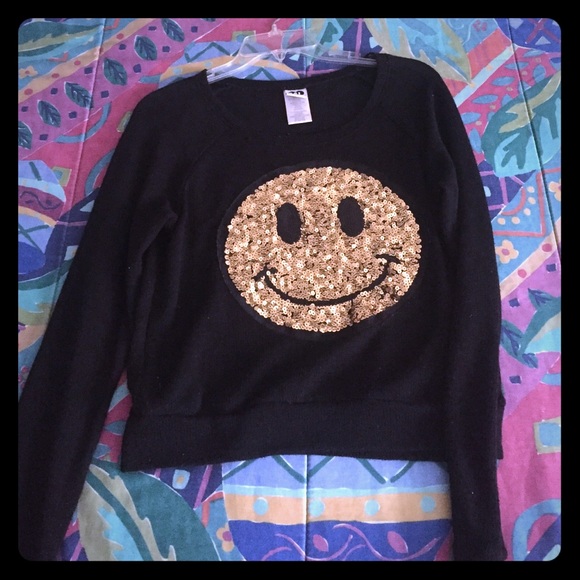 Smiley face sweater.