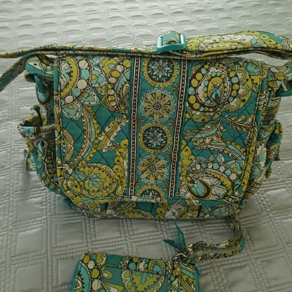 Retired peacock vera bradley purse and wristlet.