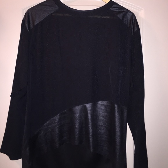 Asymmetrical black top with leather