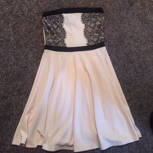 Light pink strapless dress with black lace.