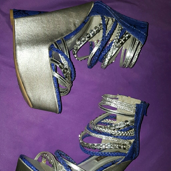 Snakeskin blue and silver multi strap wedges.