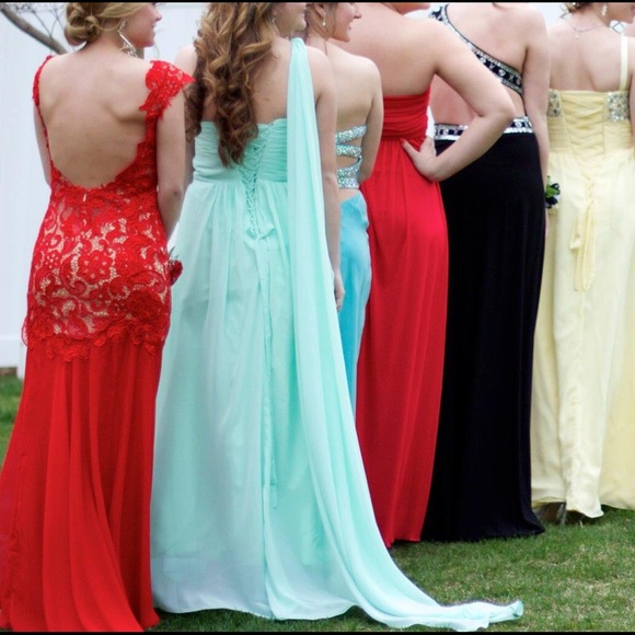 red MacDuggal lace gown with slit