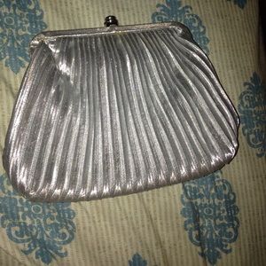 Silver clutch bag with silver strap attached