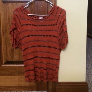 Top. Dark orange with dark grey strips.