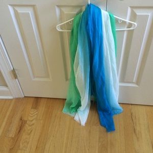 A large square scarf. Green, blue and white